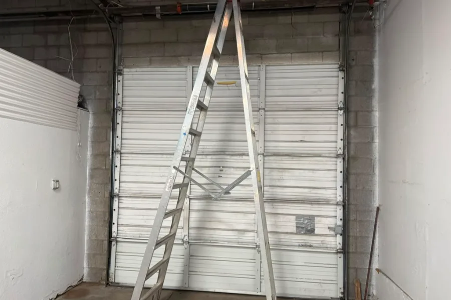 Replacement torsion springs on a commercial overhead door in a Gilbert flex building