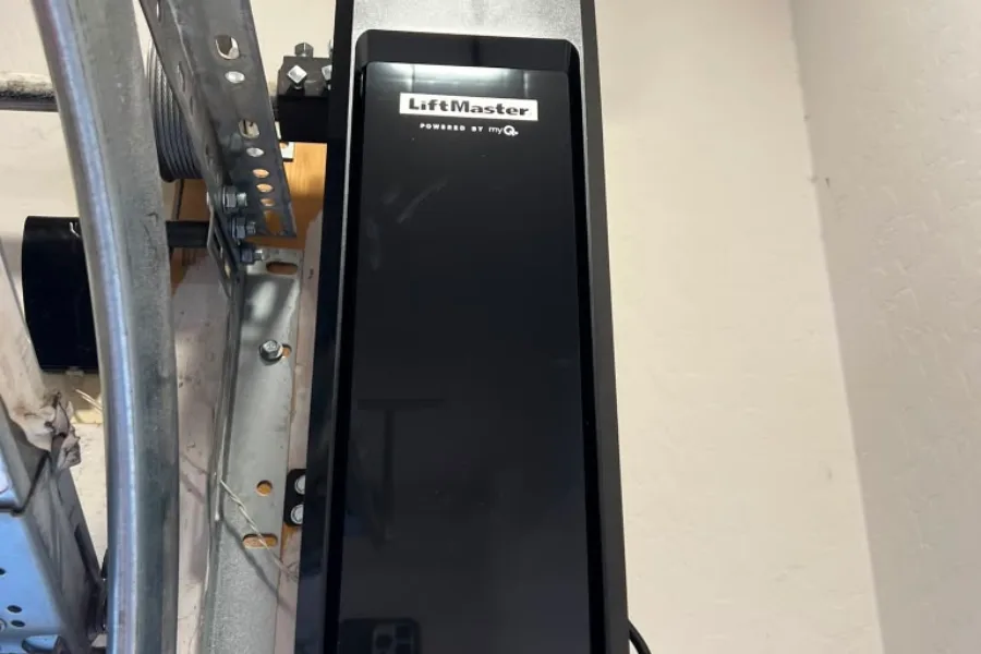 LiftMaster jackshaft wall-mounted garage door operator installed beside the torsion shaft