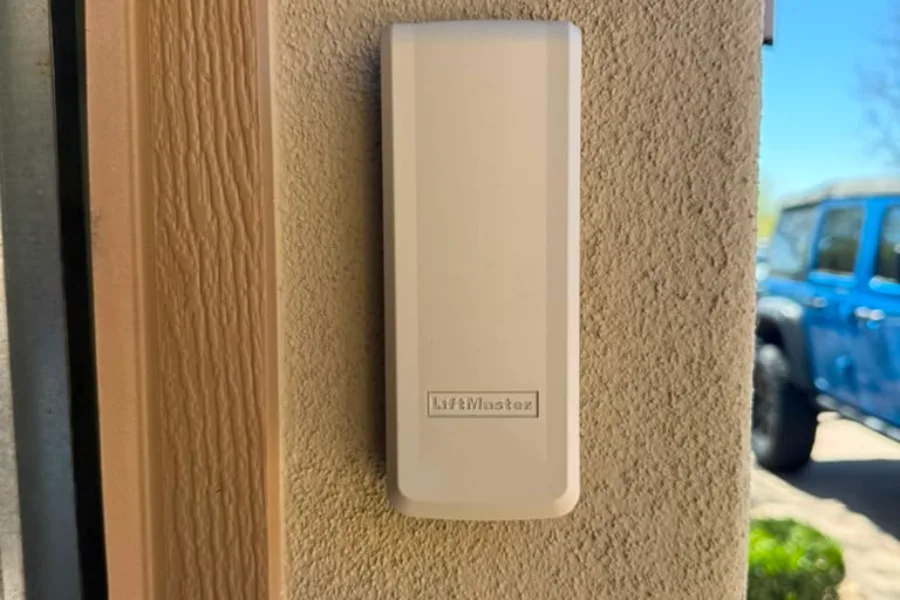 Replacement LiftMaster wireless keypad fitted beside a Gilbert garage door
