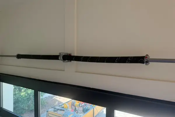 Replacement torsion spring fitted on a garage door shaft