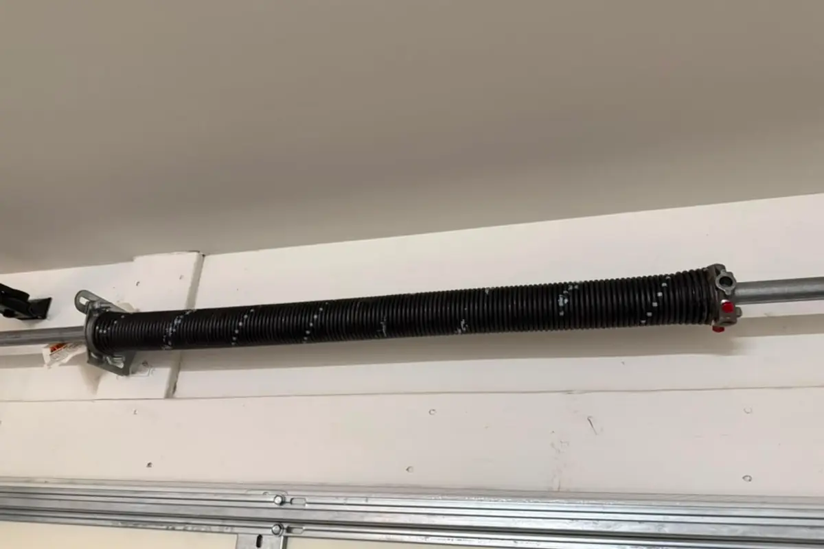 Pair of torsion springs on a garage door shaft, close up