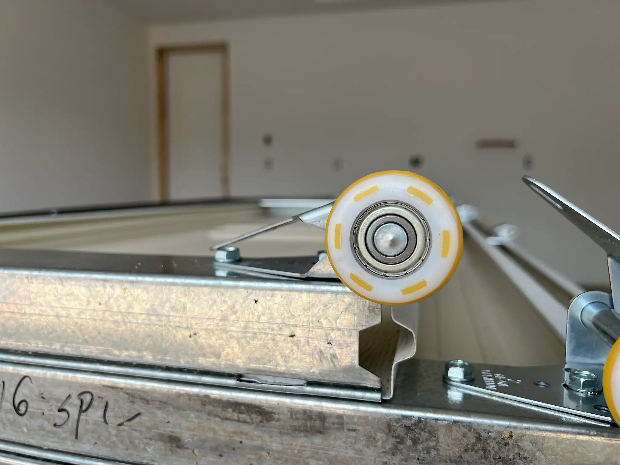 Garage door opener gear kit and parts on a workbench